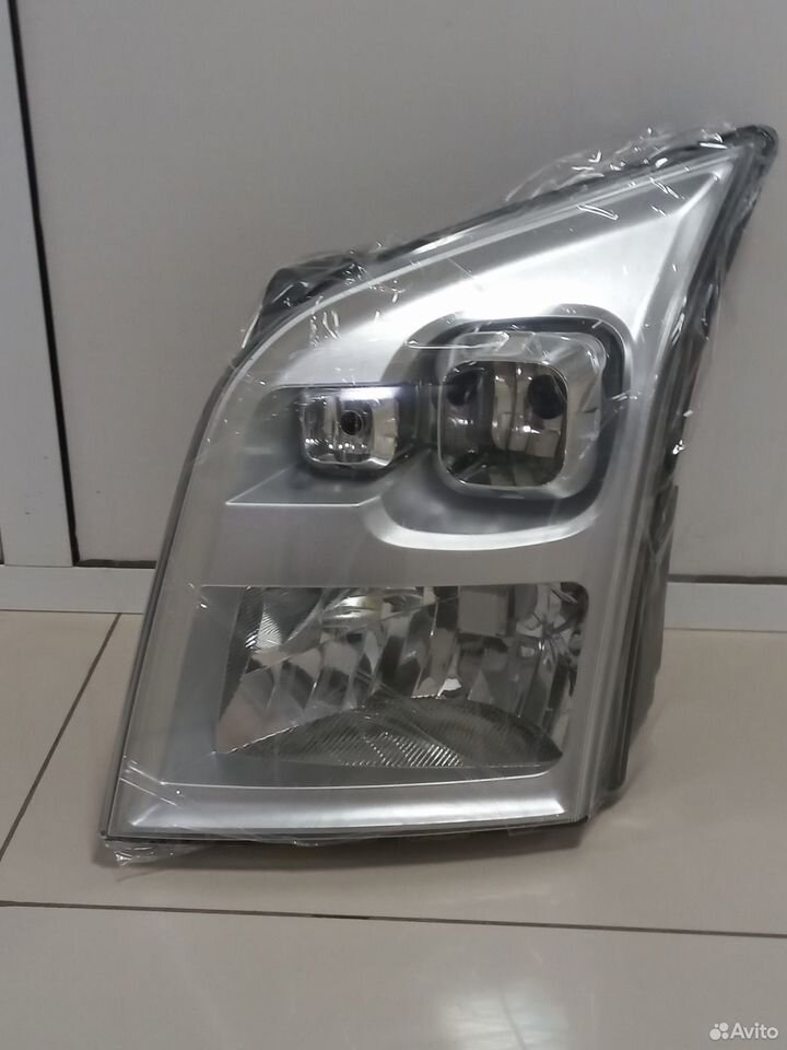Фара левая 1486100 FORD — 1486100